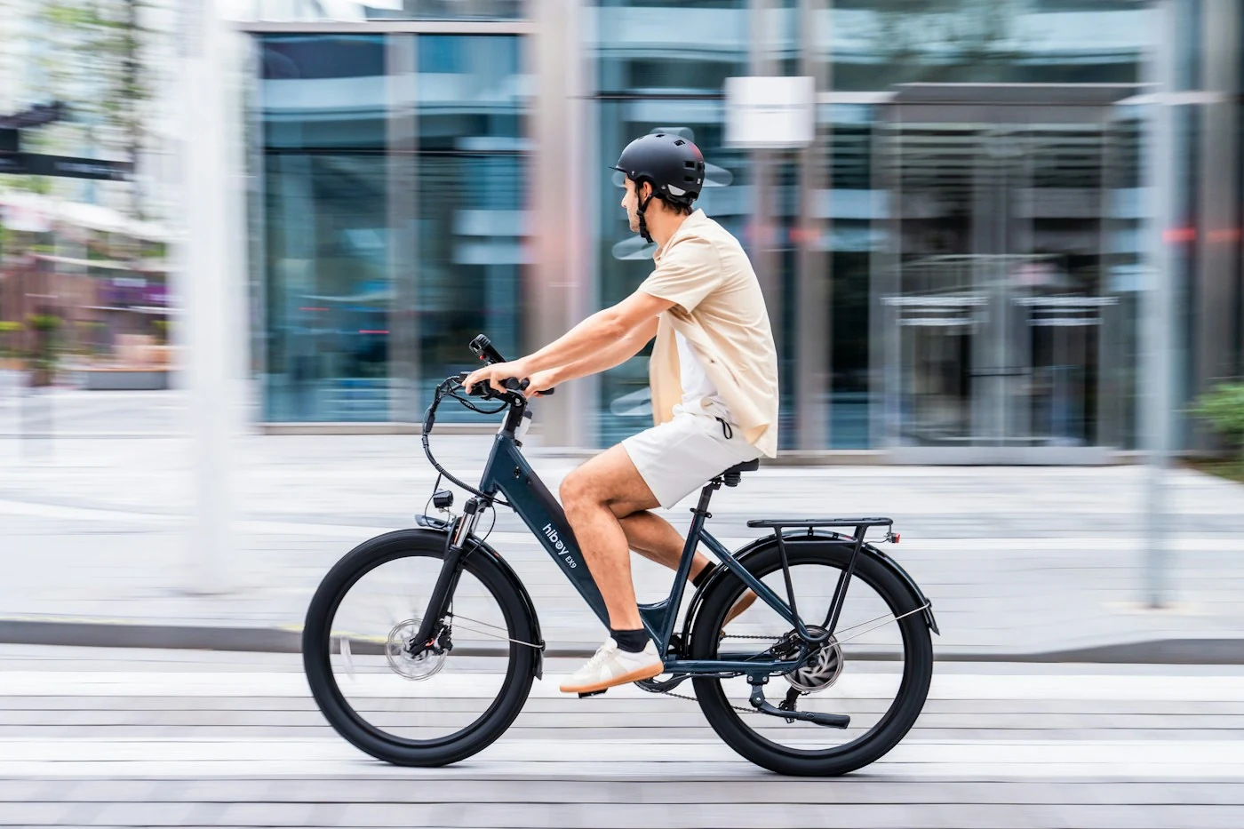 Helmeted rider commuting on an electric bicycle